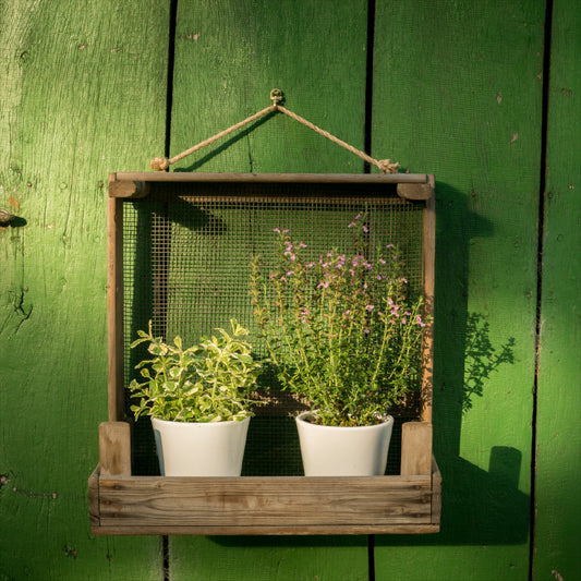 Narrow garden shelf made from onion sieve