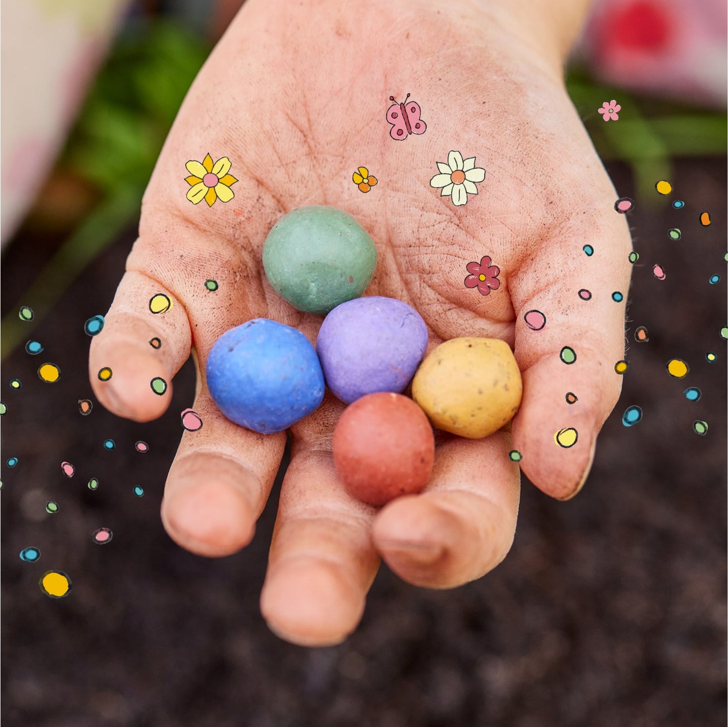 6 colorful flower marbles in an egg carton