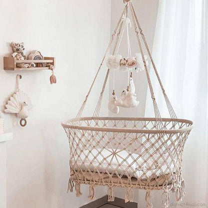 Boho hanging cradle made of macramé cotton yarn – gentle rocking for sweet dreams